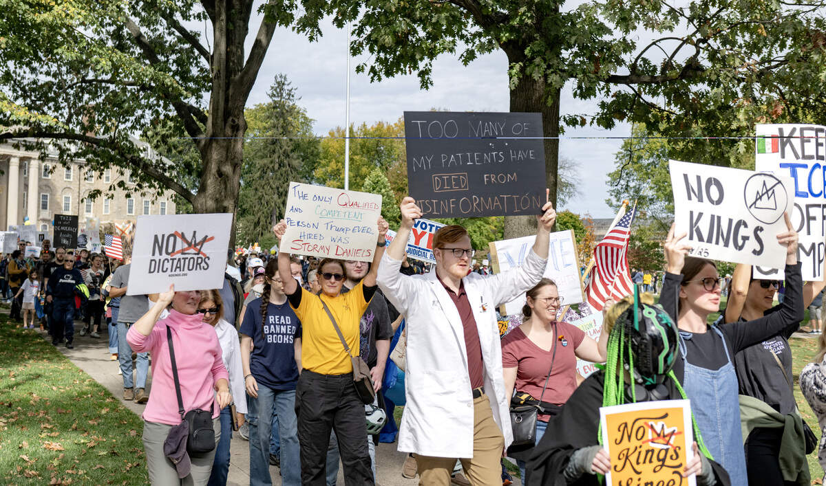 Protesters marched from Old Main throughout downtown State College as part of the No Kings anti-Trump rally on Saturday, Oct. 18, 2025.