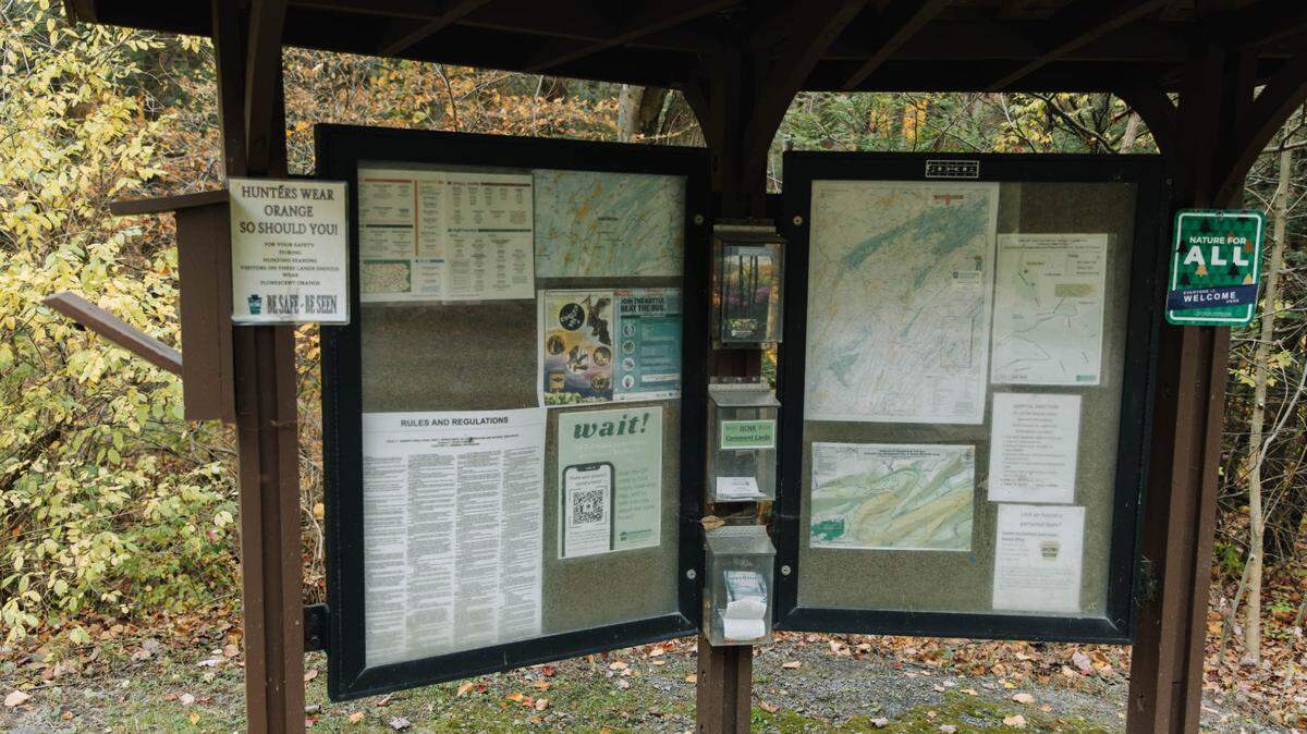 A bulletin board is pictured in Rothrock State Forest. Pennsylvania agencies overseeing outdoor recreation have made headway in expanding access to public lands, but not everyone feels safe or welcome at parks and forests.