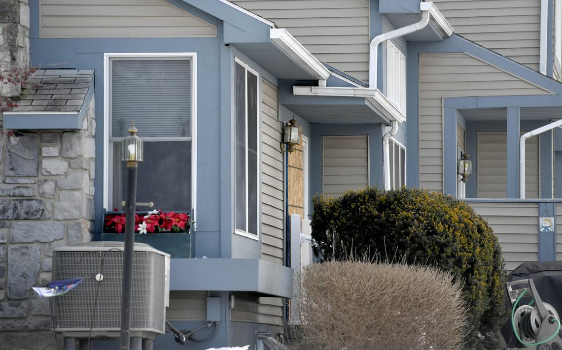 On Friday, Jan. 25, a back door is boarded of the home at 748 Tussey Lane where 83-year-old George McCormick was killed and Jordan Witmer killed himself on Thursday, Jan. 24, 2019.