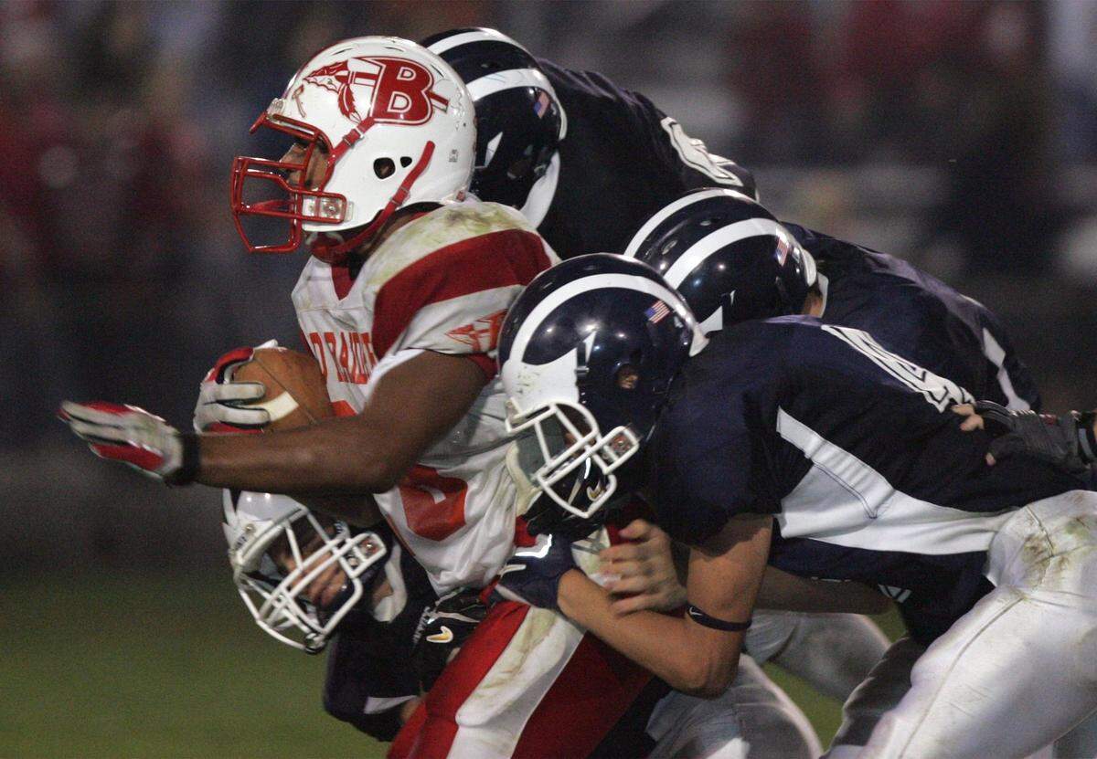 Bellefonte running back Kyle Lucas is taken down by a group of Philipsburg-Osceola defenders.