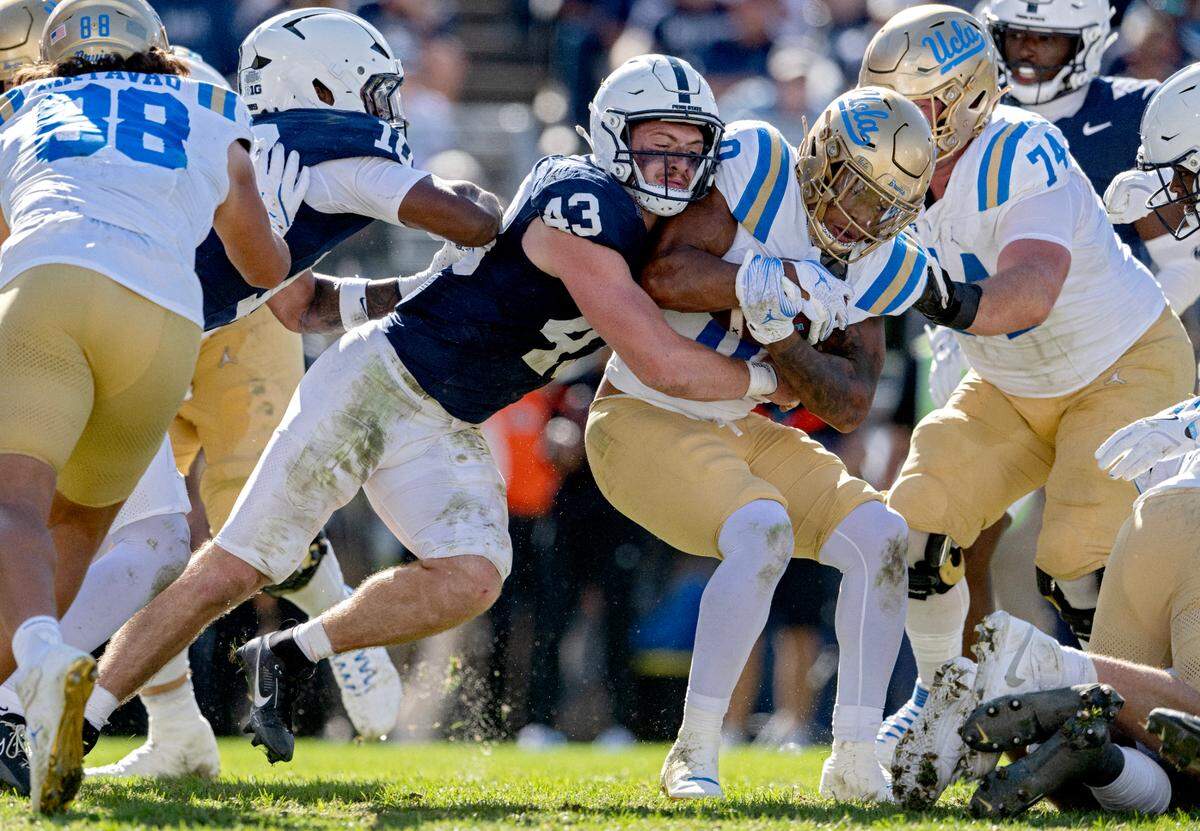 Penn State linebacker Tyler Elsdon stops UCLA’s Jalen Berger during the game on Saturday, Oct. 5, 2024 at Beaver Stadium.  