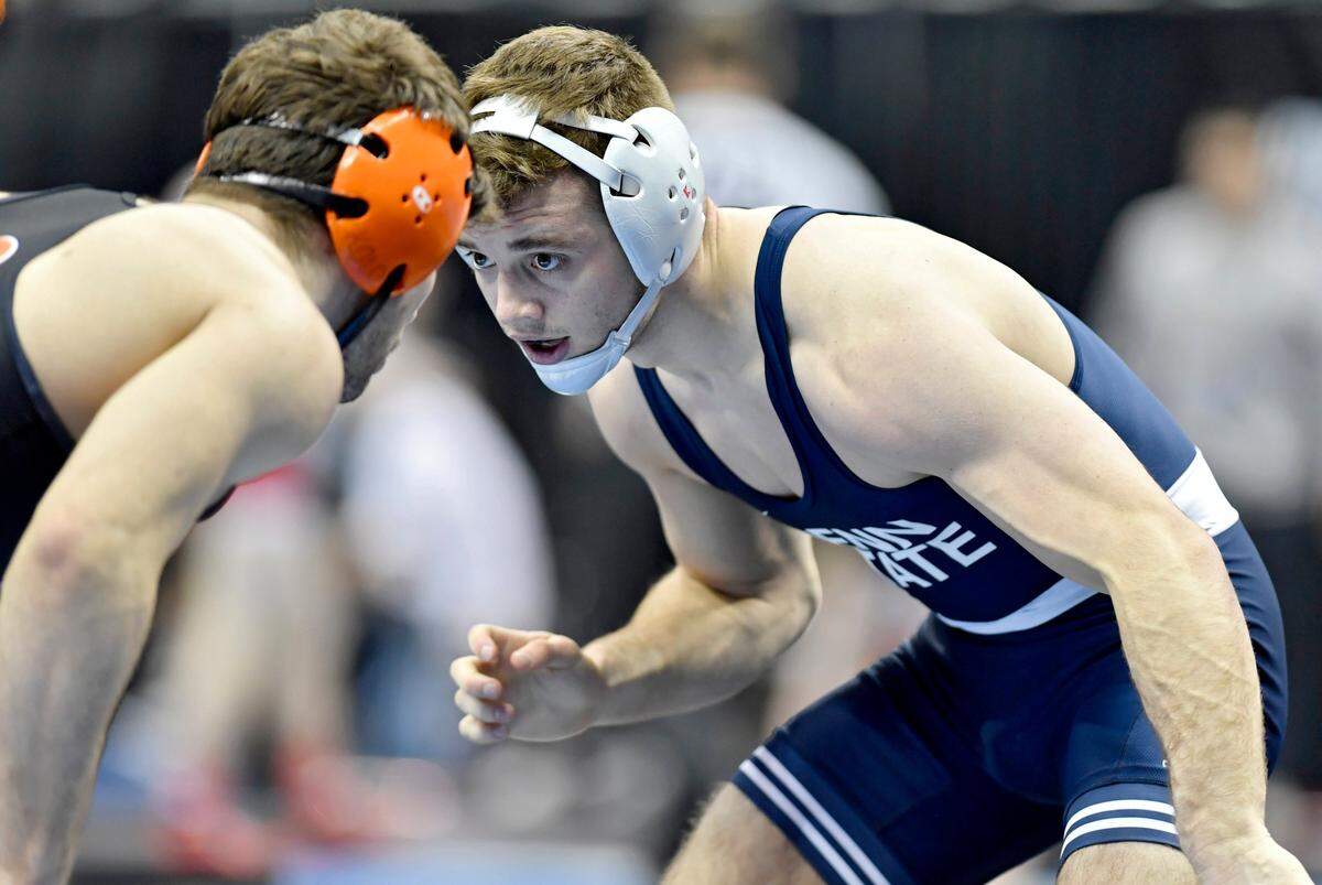Penn State’s Brady Berge wrestles Princeton’s Matthew Kolodzik in the 149 lb bout during the sweet sixteen round of the NCAA Division 1 Wrestling championships on Thursday, March 21, 2019 at PPG Paints Arena. Kolodzik won by decision, 8-5.