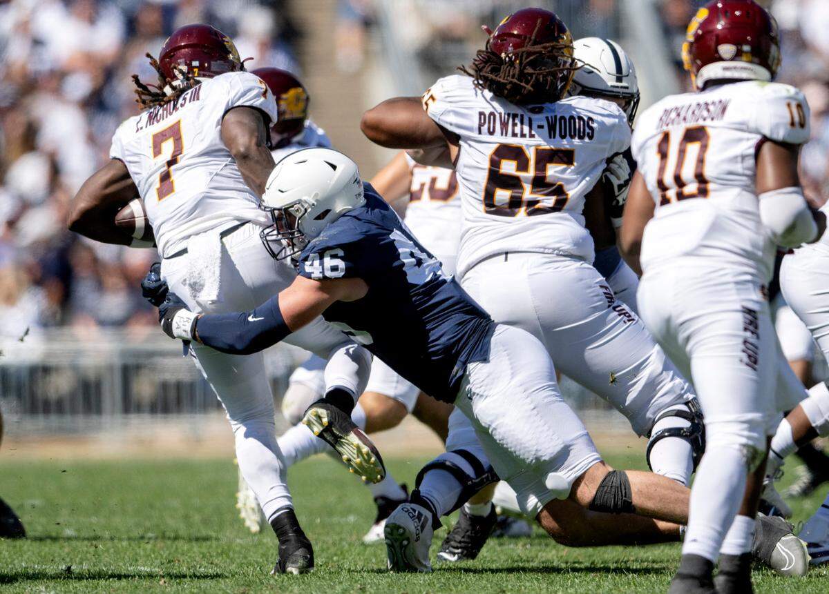 Penn State defensive end Nick Tarburton stops Central Michigan’s Lew Nichols III during the game on Saturday, Sept. 24, 2022.