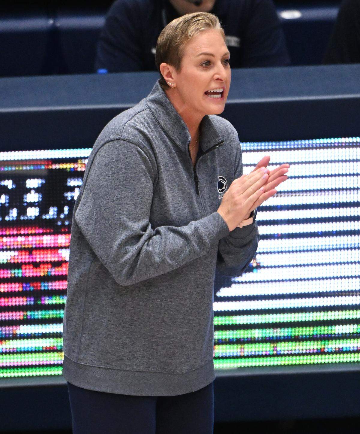 Penn State women's volleyball head coach Katie Schumacher-Cawley encourages her team from the sideline during Wednesday's match against the Pitt Panthers at Rec Hall in State College. 