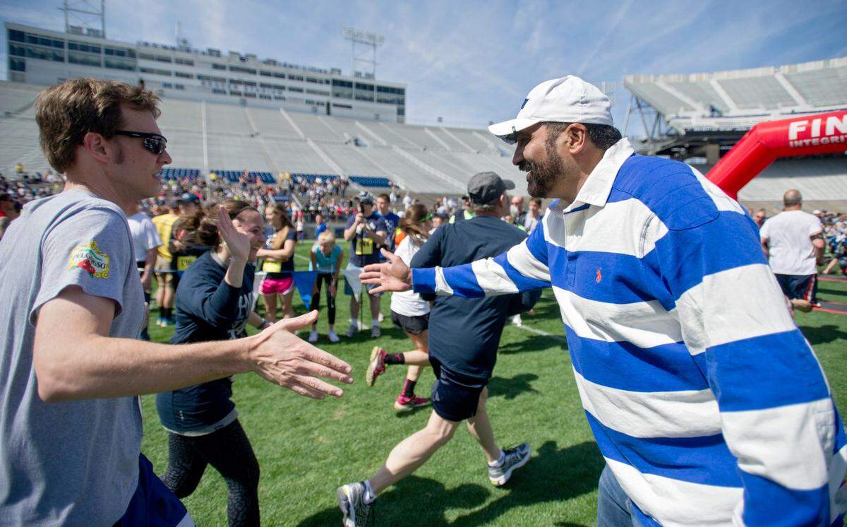 Harris welcomes runners as they complete the Paterno Family Beaver Stadium Run to benefit the Special Olympics in 2015.