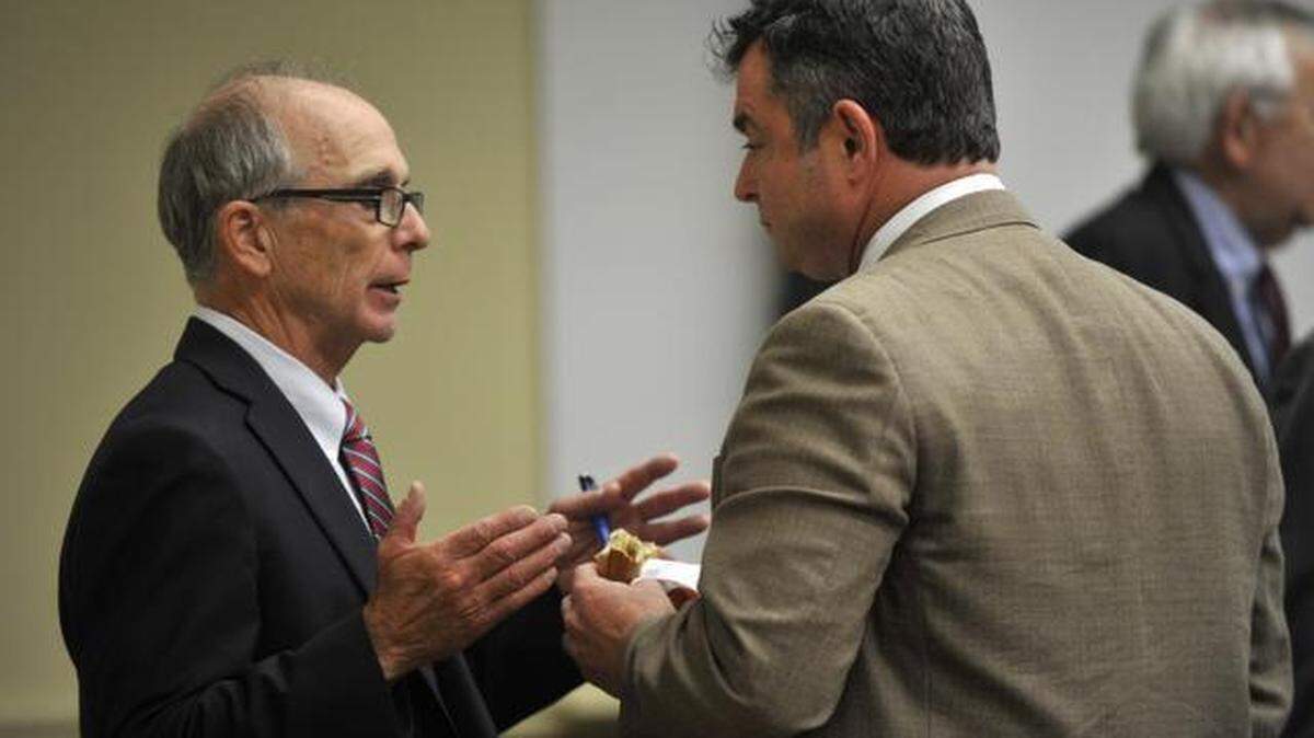 Keith Masser talks with Anthony Lubrano during a Penn State board of trustees governance committee meeting on Friday.
