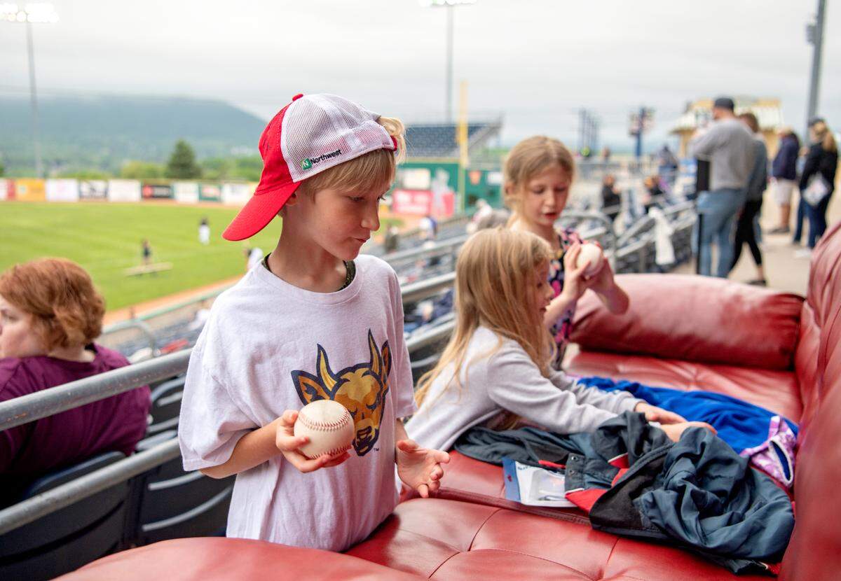 Luke Parfitt, 7, tosses a baseball before the first State College Spikes game on Monday, may 24, 2021.