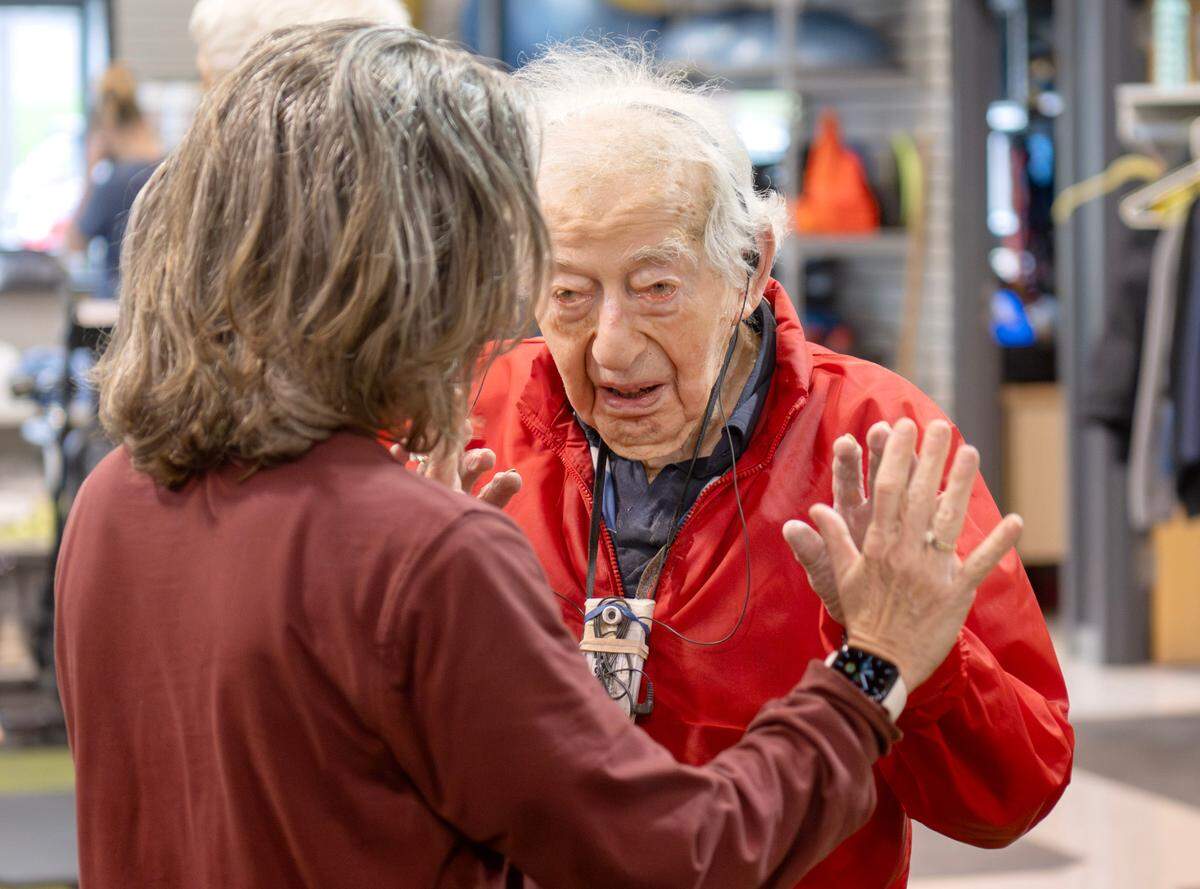George Etzweiler high-fives trainer Missy Quick after his workout at Ki’netik Fitness on Friday, April 5, 2024.