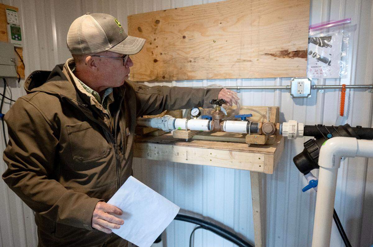 Pat Powers talks about the fertigation system they will use at Berries & Twigs farm on Friday, May 23, 2025. Fertilizer will be added to the irrigation system for the farms blueberries.
