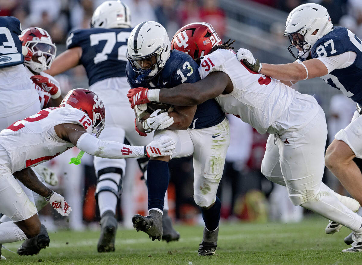 Indiana’s Dominique Ratcliff (91) stops Penn State running back Kaytron Allen during the game on Saturday, Nov. 8, 2025.