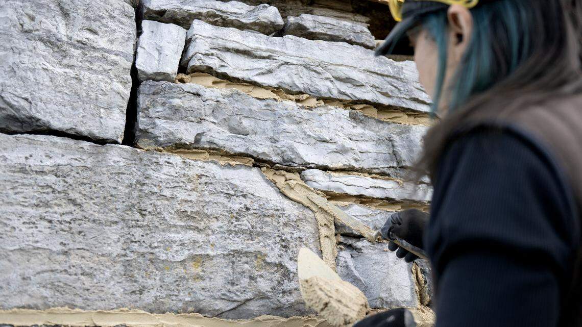 Maria Day of Sterling Stoneworks & Restoration uses a lime-based mortar to repoint the foundation of the barn on Gene and Rebecca Lengerich’s property on Wednesday, April 22, 2026.  