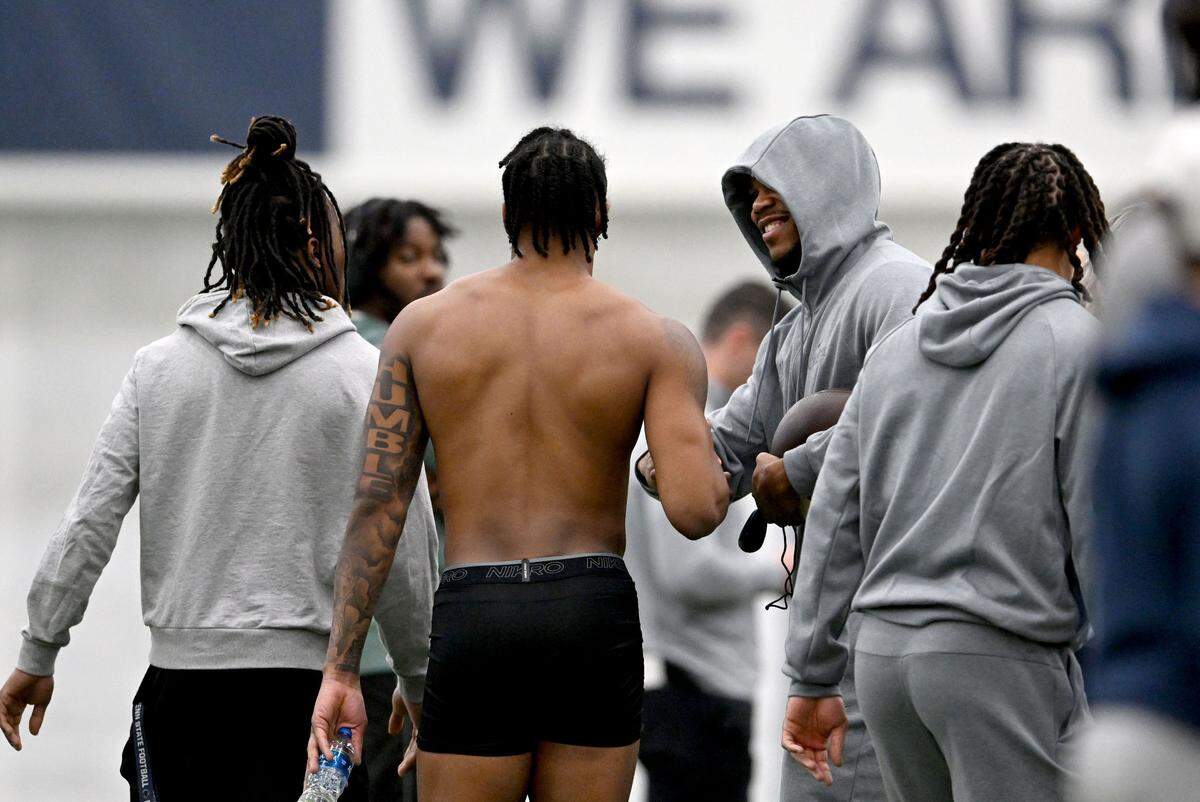Abdul Carter congratulates Jalen Kimber after his 40-yard dash during Penn State football’s pro day on Friday, March 28, 2025.