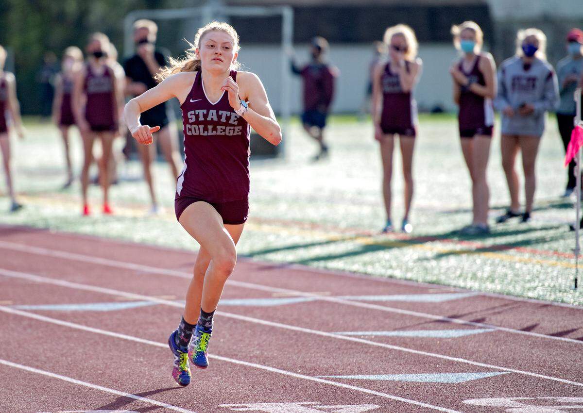 State CollegeÕs Casie Eifrig sprints in the 200 meter dash during the track meet against Mifflin County on Tuesday, April 13, 2021.