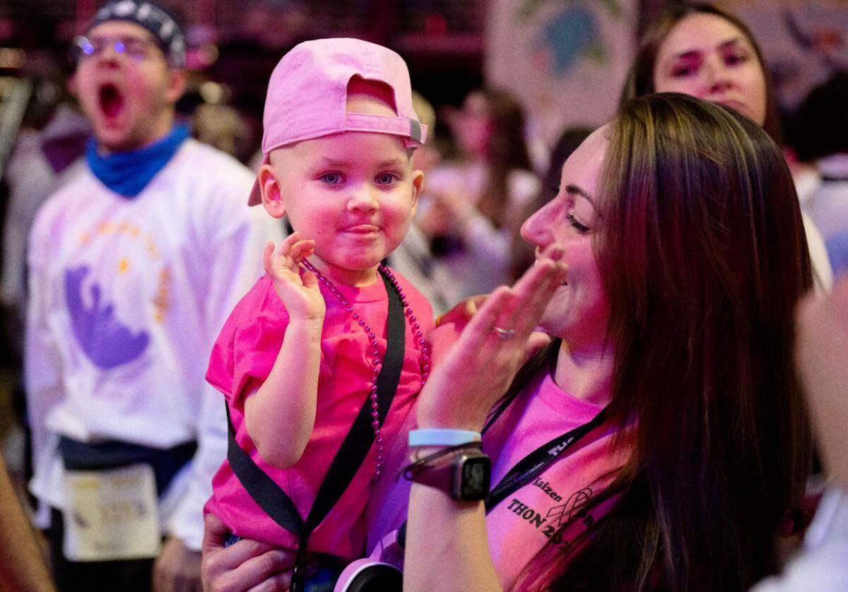 Blakely Kling, 2, dances with her mom Victoria during Penn State Thon on Friday, Feb. 21, 2025.