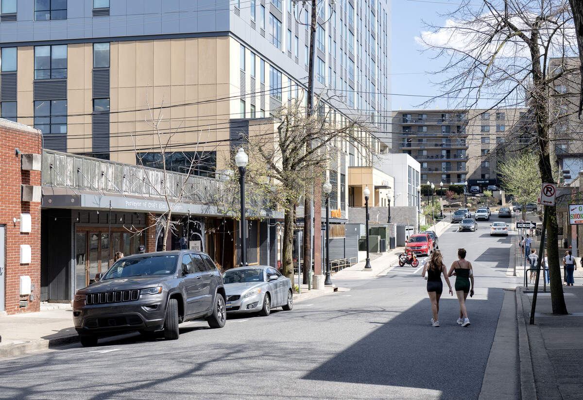 People walk along Hiester Street on Thursday, April 16, 2026. The road will close and become a pocket park "East End Social" for the summer.