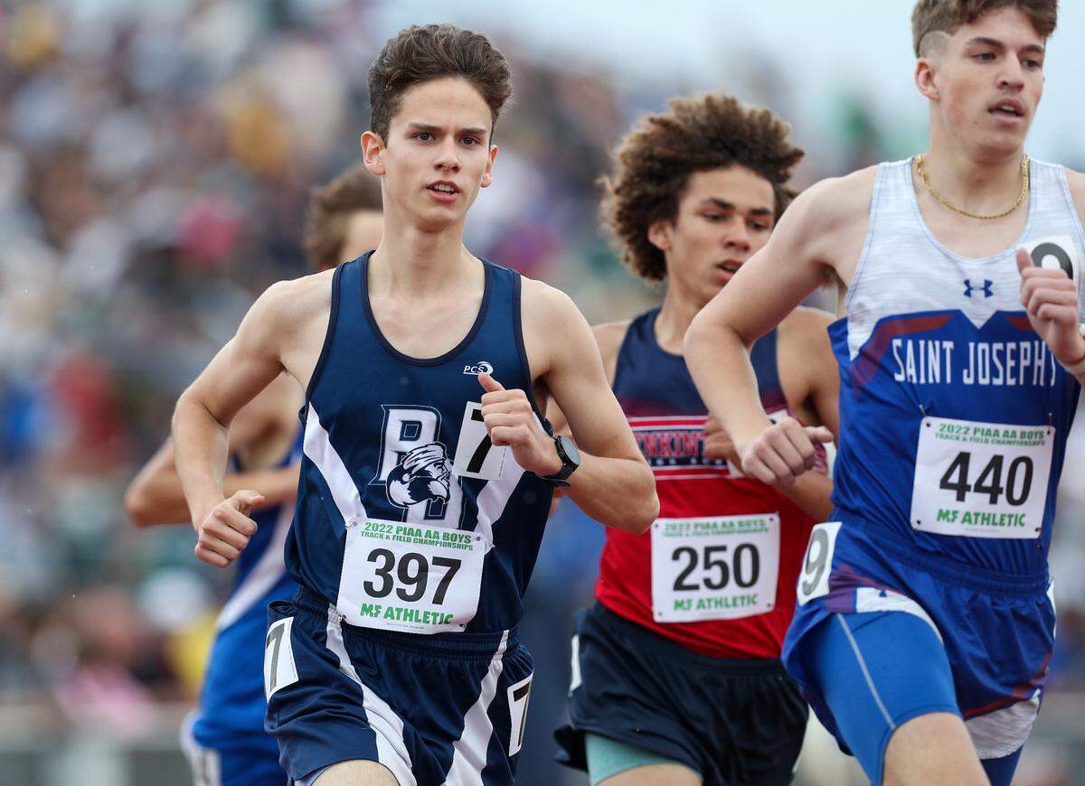 Philipsburg-Osceola’s Chad Muckey, left, competes in the boys Class 2A 1600 meter run finals during the PIAA State Track and Field Championships held Friday at Seth Grove Stadium on the Shippensburg University campus.