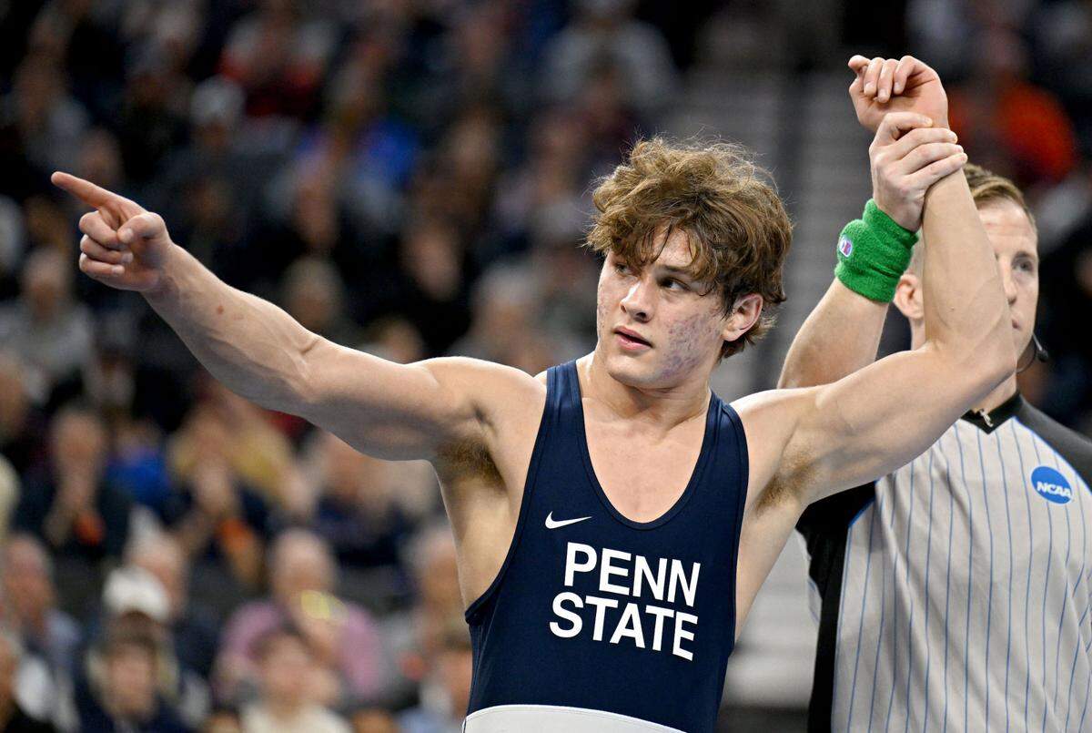 Penn State’s Tyler Kasak points to the crowd after placing third at 157 pounds in the 2025 NCAA Wrestling Championships in Philadelphia’s Wells Fargo Center on Saturday, March 22, 2025.