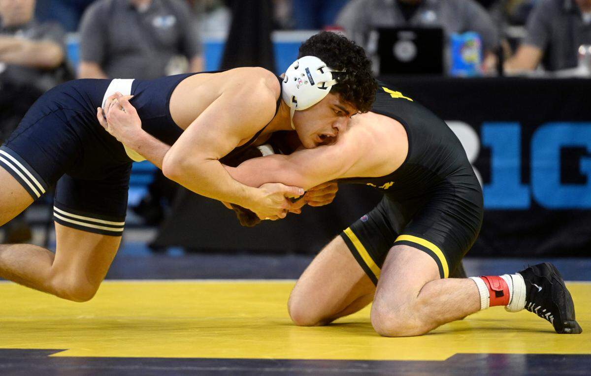 Penn State’s Beau Bartlett wrestles Michigan’s Cole Mattin in a 141 lb quarterfinal bout of the Big Ten wrestling championships at the Crisler Arena in Ann Arbor Michigan on Saturday, March 4, 2023.
