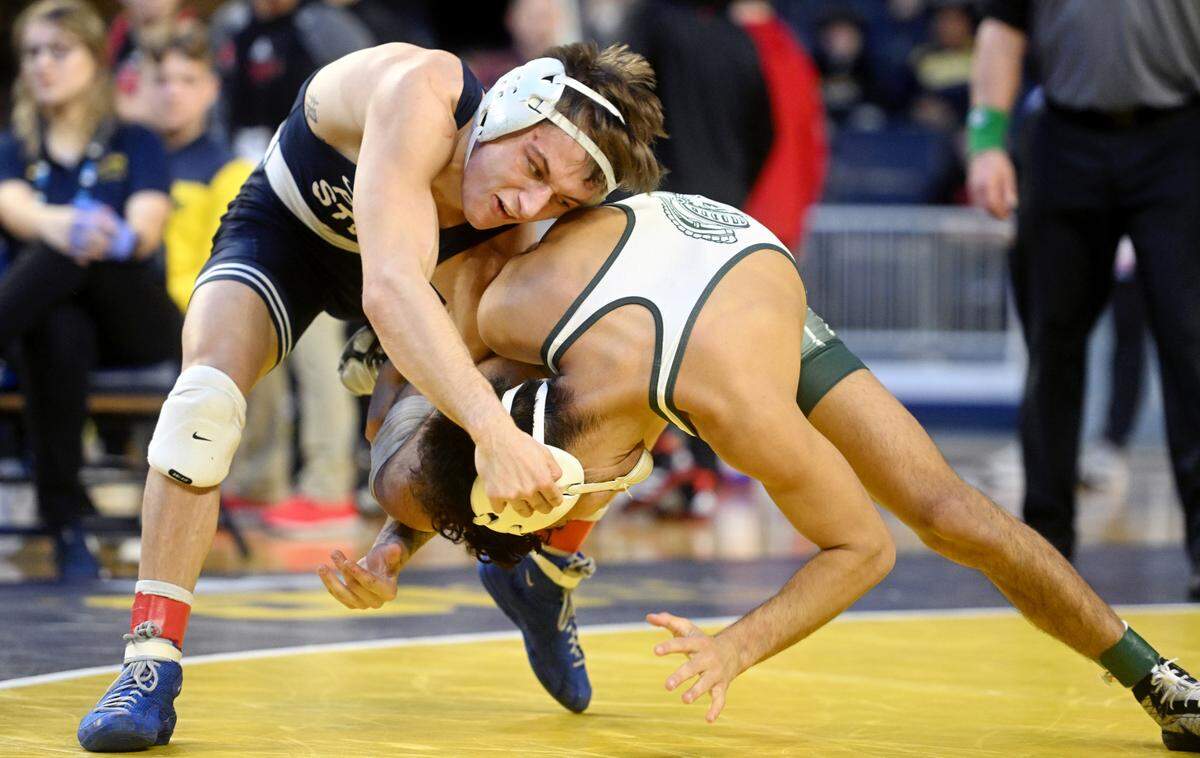 Penn State’s Gary Steen wrestles Michigan State’s Tristan Lujan in a 125 lb bout at the Crisler Center on Sunday, March 5, 2023. The match did not count towards team points and was for placings.
