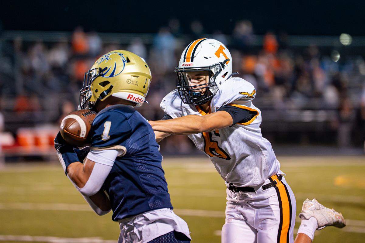 Bald Eagle Area wide receiver Kollin Cunningham (1) gets pushed by defensive back Mason Emigh (6) during the game against Tyrone on Friday, Sept. 12, 2025, at Alumni Stadium in Wingate, Pa. The Golden Eagles beat the Bald Eagles 21-14.
