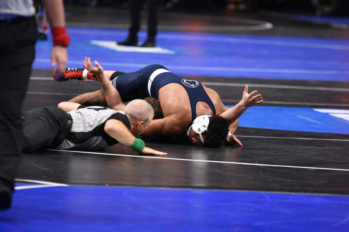 Penn State’s Carter Starocci looks for the pin on Rutgers’ Connor O’Neill in their 174-pound first round match of the NCAA Championships on Thursday, March 17, 2022 at Little Caesar’s Arena in Detroit. Starocci pinned O’Neill in 6:38.