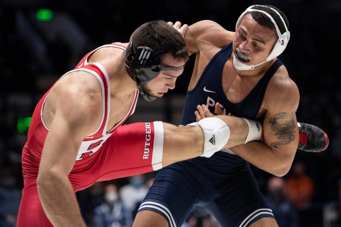 Penn State’s Aaron Brooks grabs his opponent’s leg during a wrestling dual between Penn State and Rutgers on Sunday, Jan. 16, 2022 at Rec Hall in University Park, Pa. Penn State defeated the Scarlet Knights 27-11.