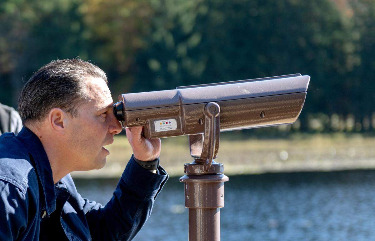 Pennsylvania Governor Josh Shapiro uses the new color-correcting viewfinder at Black Moshannon State Park on Wednesday, Oct. 9, 2024.