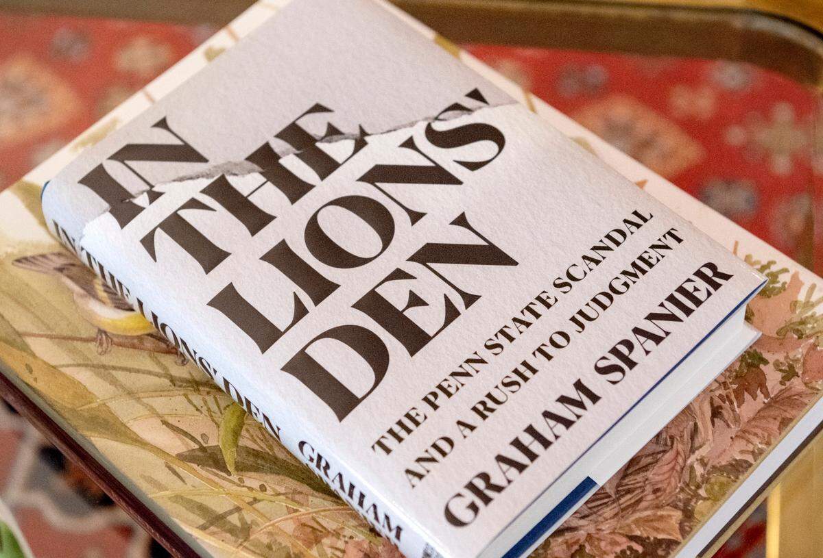 Graham Spanier’s book, “In the Lions Den,” sits on the coffee table at his home on Thursday, Sept. 8, 2022.