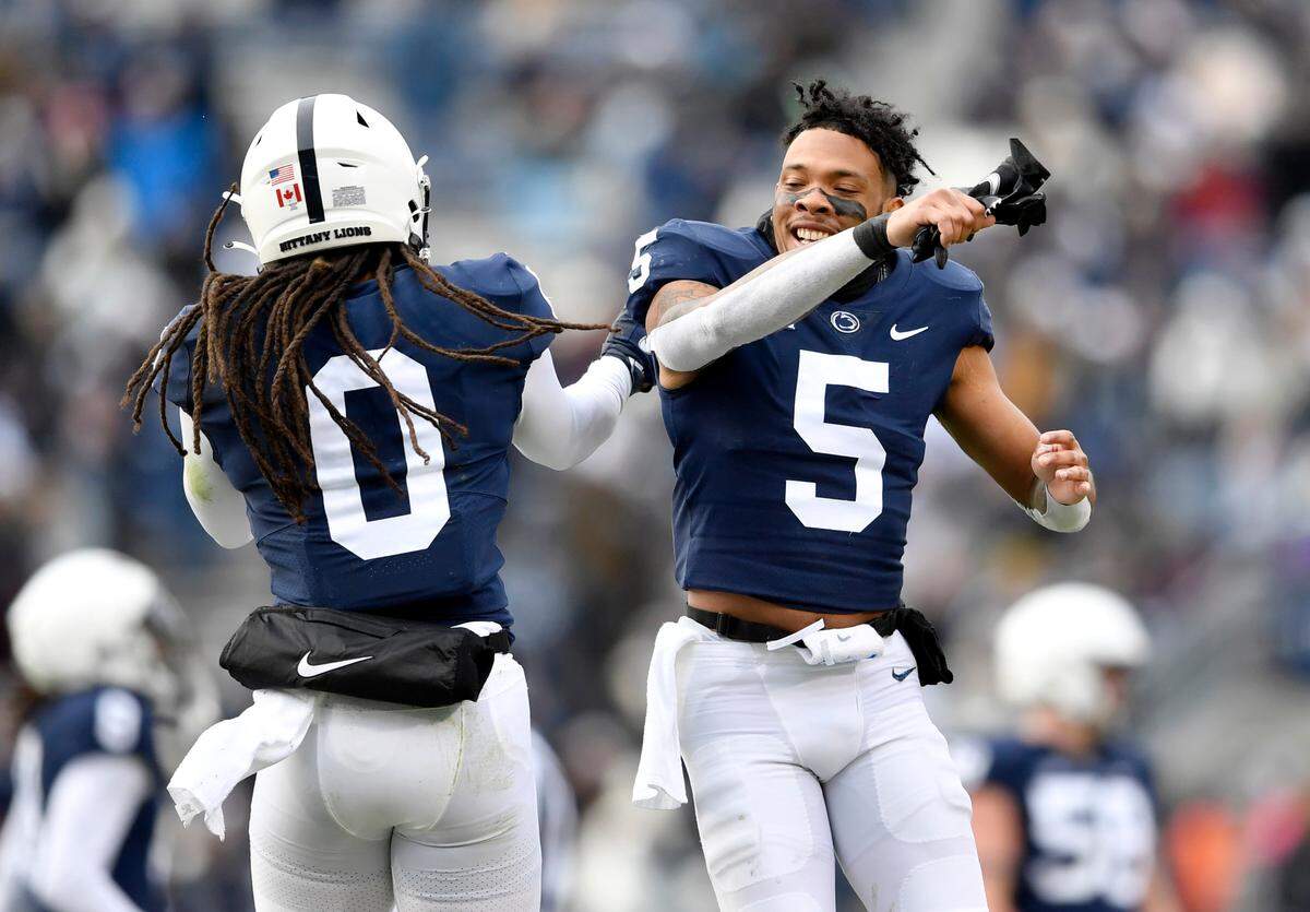 Penn State safety Jonathan Sutherland celebrates his interception with cornerback Tariq Castro-Fields during the game against Rutgers on Saturday, Nov. 20, 2021.