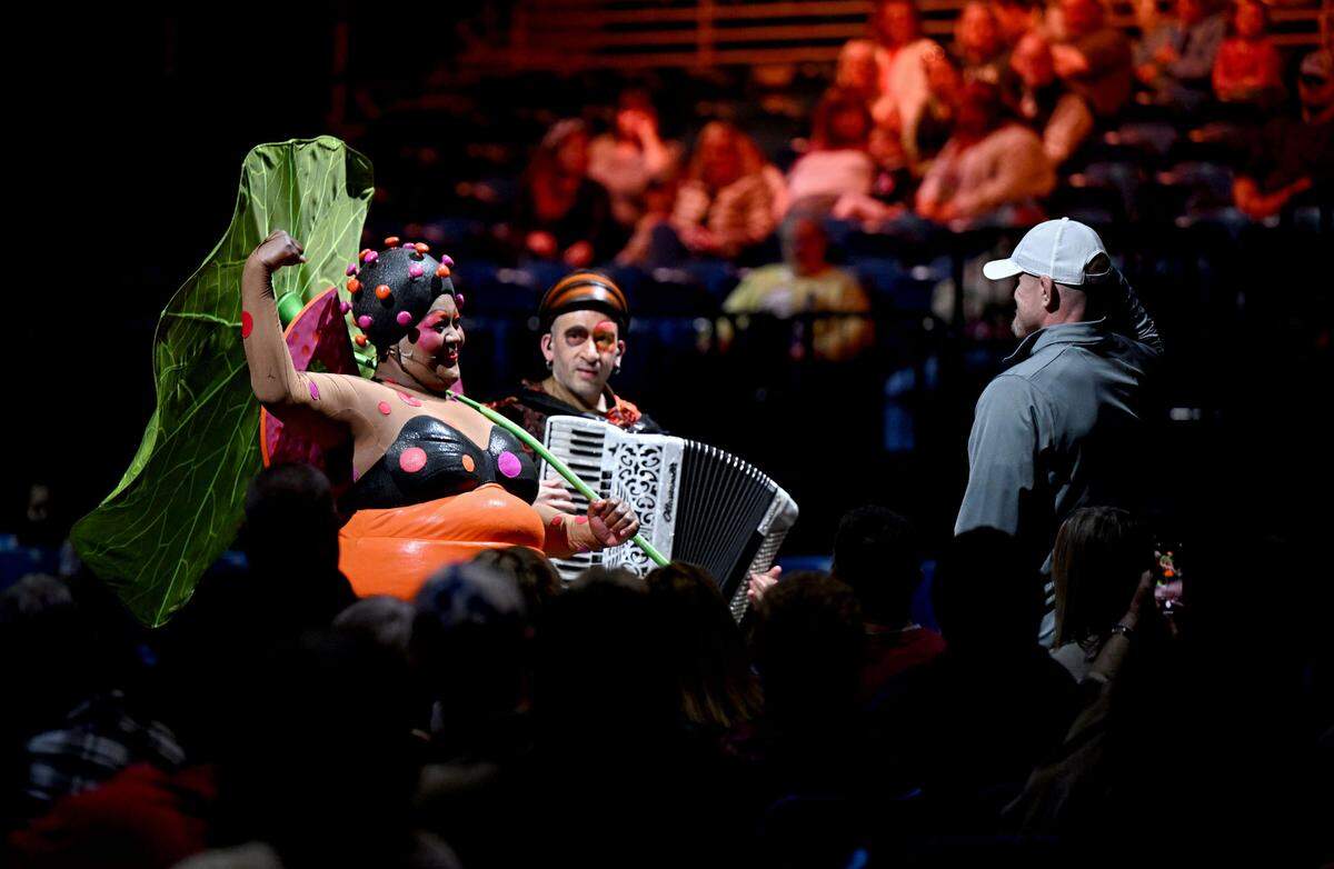 The Ladybug selects an audience member to show their muscles at the start of the Cirque du Soleil show Ovo at the Bryce Jordan Center on Thursday, March 27, 2025.