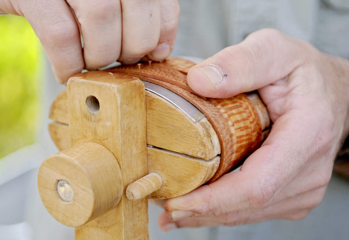 Woodworker Steve Strouse makes places nails as he makes shaker-style wooden oval boxes during a demonstration outside of the Gallery Shop in Lemont on Saturday, May 4, 2013.