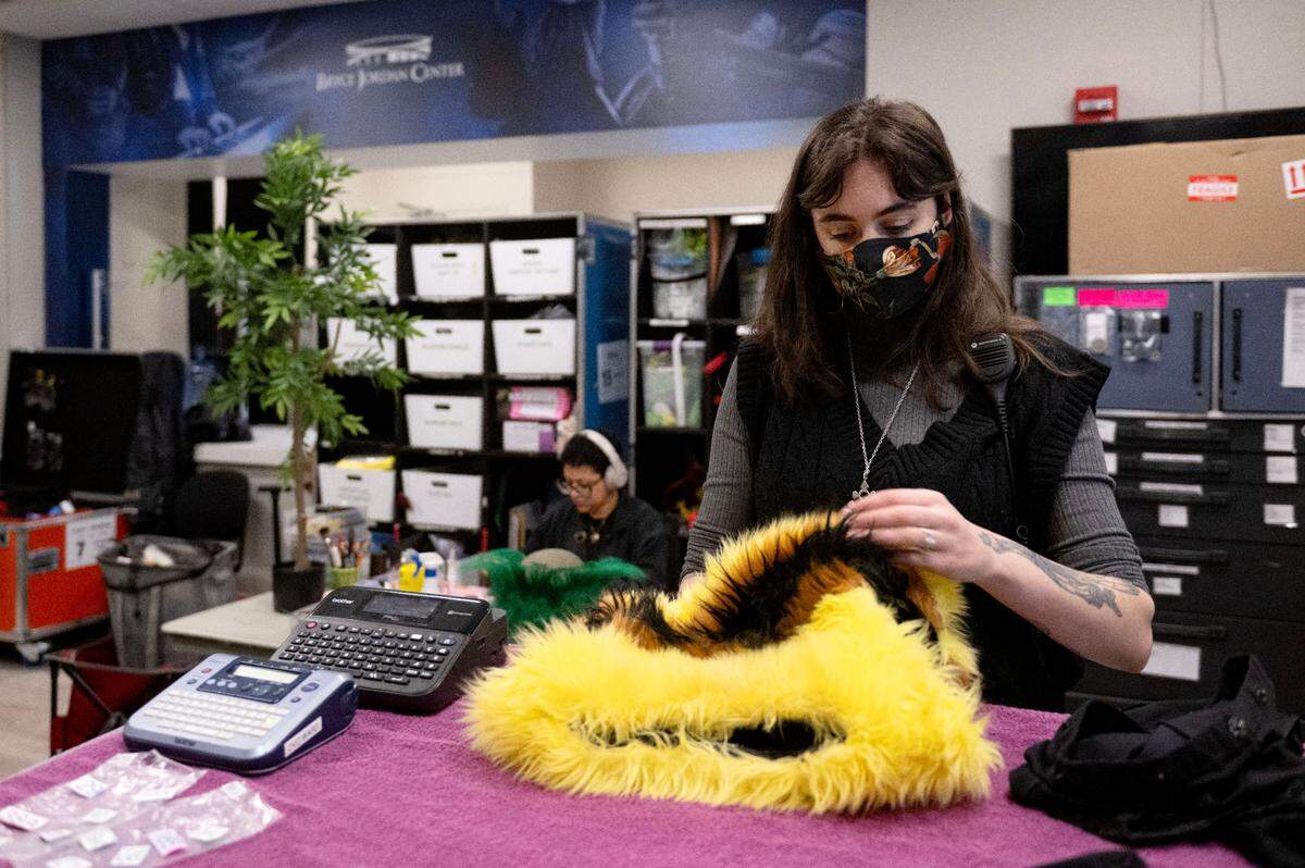Wardrobe artist Mariah McDonald works on a bee costume that is featured in the Cirque du Soleil show “Ovo” at the Bryce Jordan Center on Thursday, March 27, 2025.