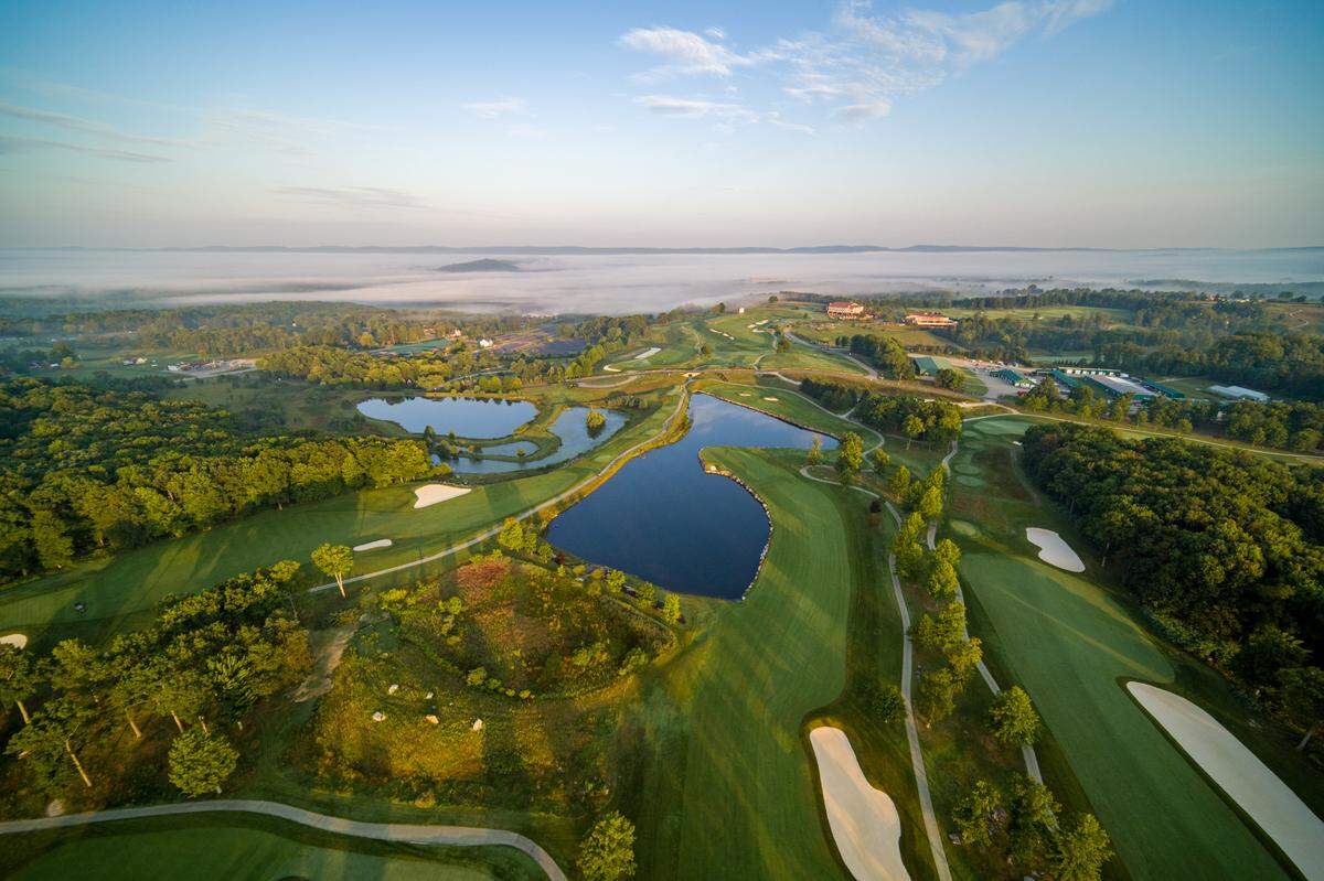 An aerial view of the Mystic Rocks golf course, featuring the many sand bunkers architect Pete Dye was famous for incorporating into his courses.