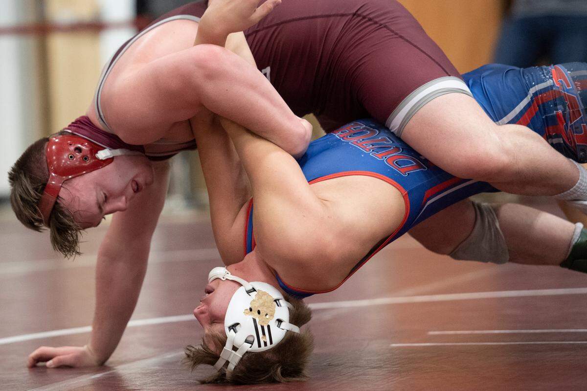 State College’s Carson Manville wrestles St. Marys’ Waylon Wehler during the PIAA NW AAA Regional Wrestling Tournament at Altoona Area High School on Feb. 27, 2021 in Altoona, PA.