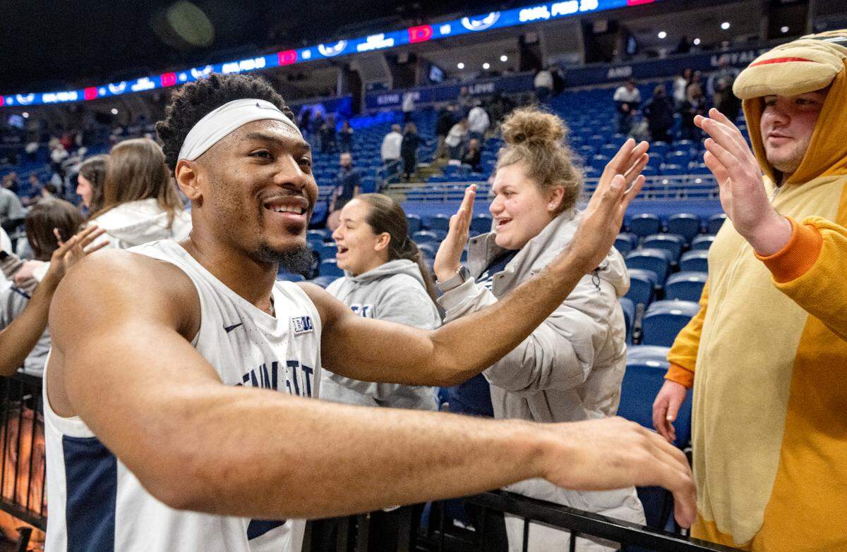 Penn State’s Jalen Pickett high fives fans after his 41 point game in the 93-81 win over Illinois on Tuesday, Feb. 14, 2023.