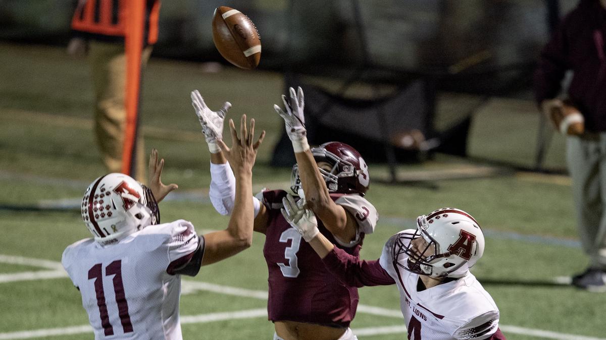 State College’s Keaton Ellis, Penn State’s first official commit of the 2019 class, jumps for the ball between Altoona defenders during his team’s 49-14 win on Oct. 19 at Memorial Field.