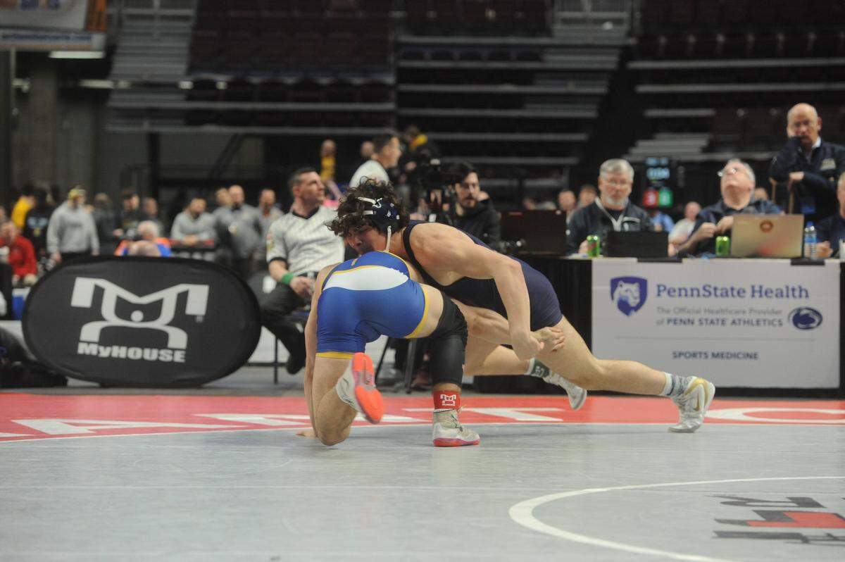 Bald Eagle Area’s Caleb Close goes for a takedown finish on Johnsonburg’s Kaden Dennis in their 172-pound consolation third round match during the PIAA Class 2A Championships on Friday, March 11, 2022 at Giant Center in Hershey. Close beat Dennis, 5-1, to secure a spot on the PIAA podium.
