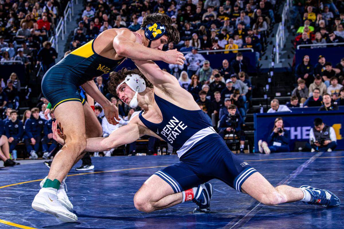 Penn State’s Levi Haines goes for a shot on Michigan’s Beau Mantanona in their 174-pound bout of the Nittany Lions’ 38-3 win on Friday in Ann Arbor, Mich. Haines racked up a 19-4 technical fall on Mantanona in 6:58.