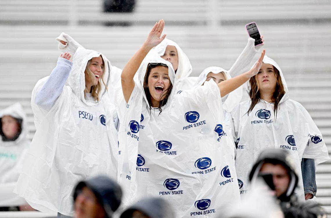 Penn State fans dance in the rain during the Blue-White Practice on Saturday, April 25, 2026.  