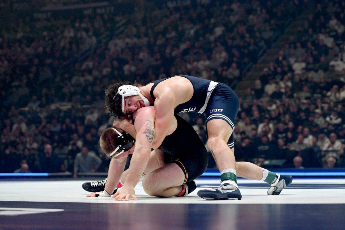 Penn State’s Levi Haines controls Iowa’s Patrick Kennedy in the 174-pound bout of the match on Friday, Jan. 31, 2025 at the Bryce Jordan Center.  Haines won by decision 10-3.  
