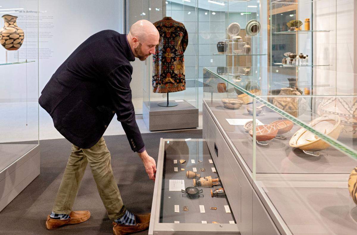 James Doyle shows a drawer of artifacts collected by Frederick Matson in the Matson Museum of Anthropology In the Susan Welch Liberal Arts Building on Thursday, May 1, 2025. The drawers allow for more items to be on display, especially those sensitive to light.