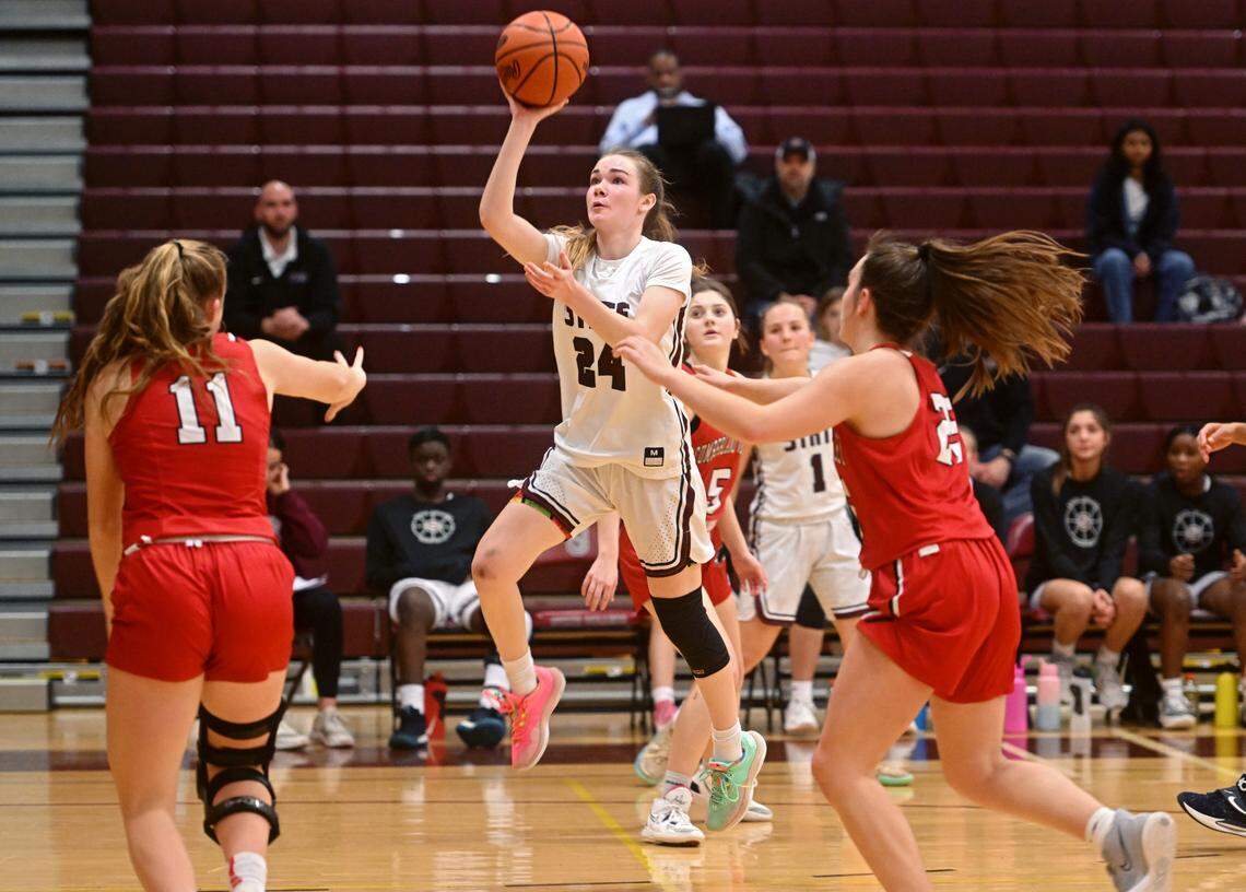 State College’s Jordyn Steindl shoots for a basket over Cumberland Valley defenders during the game on Tuesday, Jan, 24, 2023.