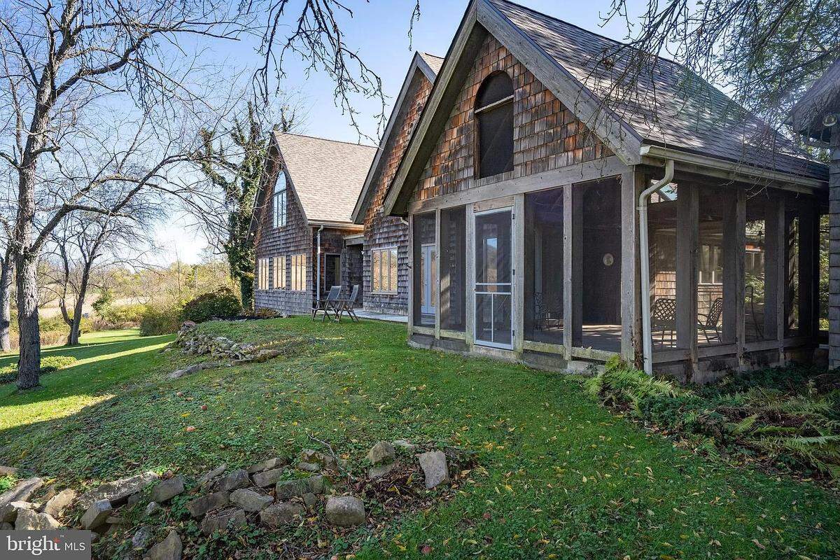 A view of the screened-in porch and backyard at 311 Cedar Run Road in Boalsburg. Photo shared with permission from the home’s listing agent, Kristin O’Brien of Keller Williams Advantage Realty.