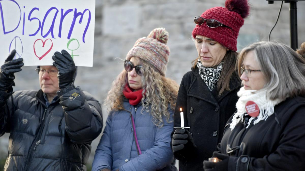 State College community members gather at the Allen Street Gates on Monday to remember the victims of last week’s shooting during the “Standing at the Gates for Justice” group’s gathering.
