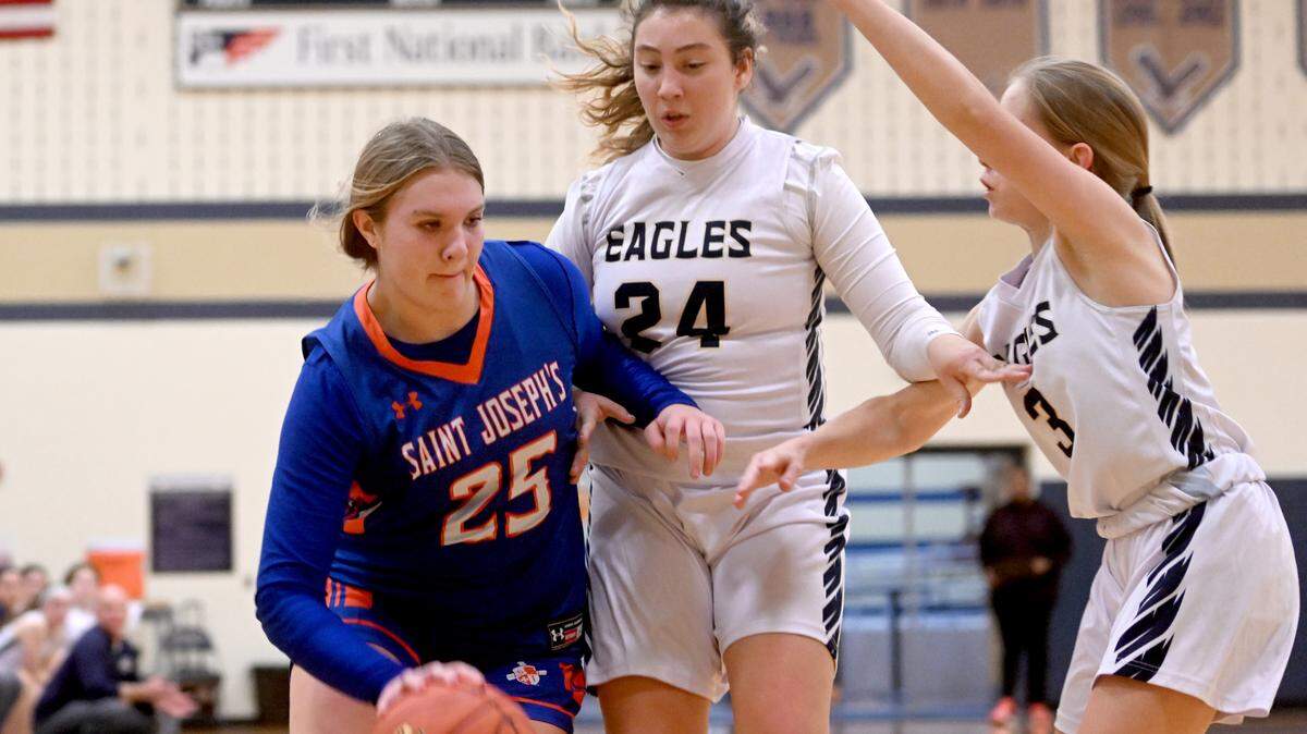 Saint Joseph’s Aubrey Yartz dribbles around Bald Eagle defenders during their Dec. 6 game.