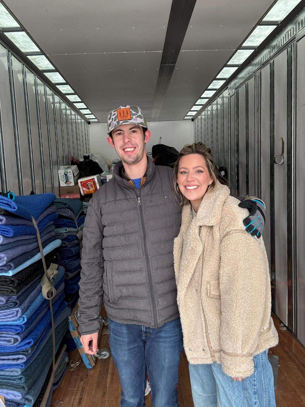 Evan Boone and Emily Boone in the truck as it is filled with donations.