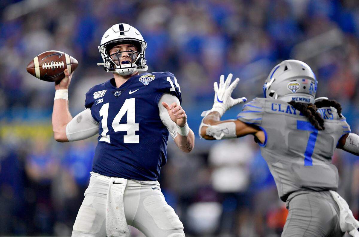 Penn State quarterback Sean Clifford makes a pass over a Memphis defender during the 84th Goodyear Cotton Bowl Classic at AT&T Stadium in Arlington, TX on Saturday, Dec. 28, 2019.