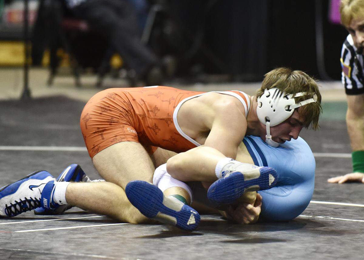 St. Joseph’s Catholic Academy’s Caleb Dowling wrestles Burrell’s A.J. Corrado for the 152-pound championship at the Southwest Regional tournament Saturday at the Kovalchick Convention and Athletic Complex on the campus of Indiana University of Pennsylvania. Dowling won 2-1.