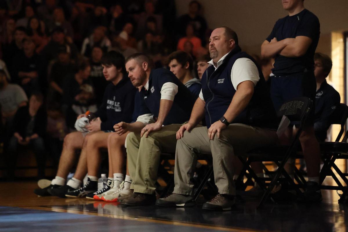 Penns Valley head coach Joel Brinker (sitting closest) and assistant coach Mike Wise watch on during the 107-pound bout of the Rams’ 31-27 win over Bald Eagle Area on Tuesday, January 10, 2023.