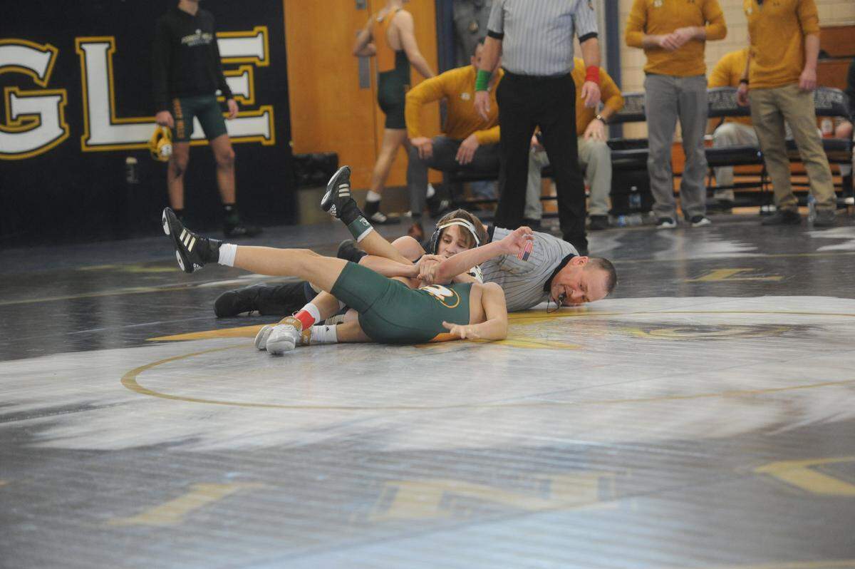 Bald Eagle Area’s Owen Johnson looks for the pin on Forest Hills’ Brevin Michuk in their 120-pound bout of the Eagles’ 32-30 loss in District 6 Class 2A semifinals on Saturday, Feb. 5, 2022. Johnson did pin Michuk in 3:13.